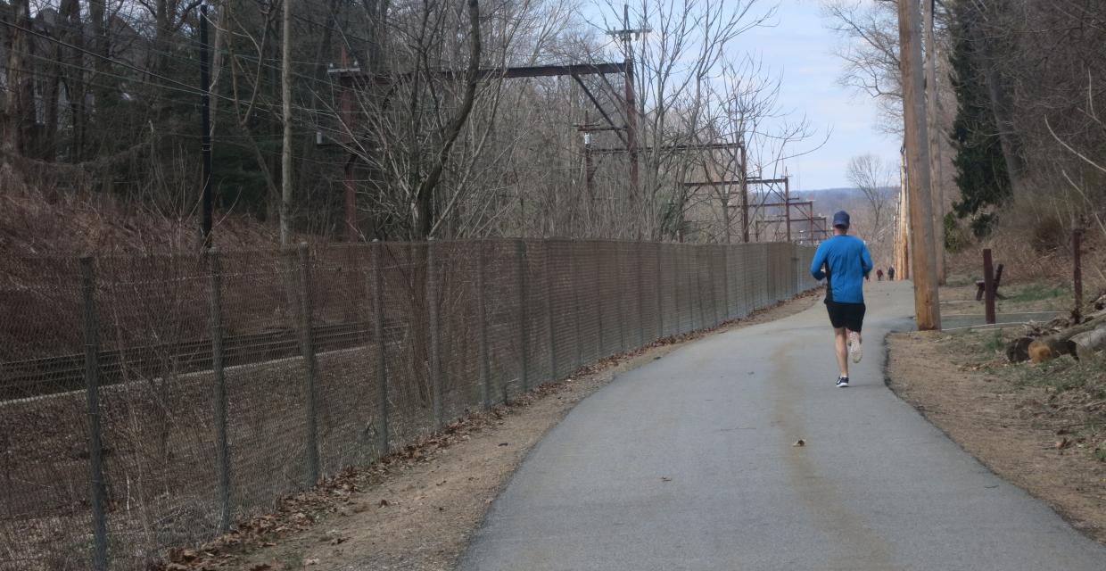 A jogger along the Traction Line Recreation Trail - Photo by Daniel Chazin